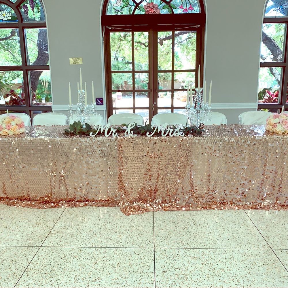 $60 each 4 oblong blush/ rose gold tablecloths